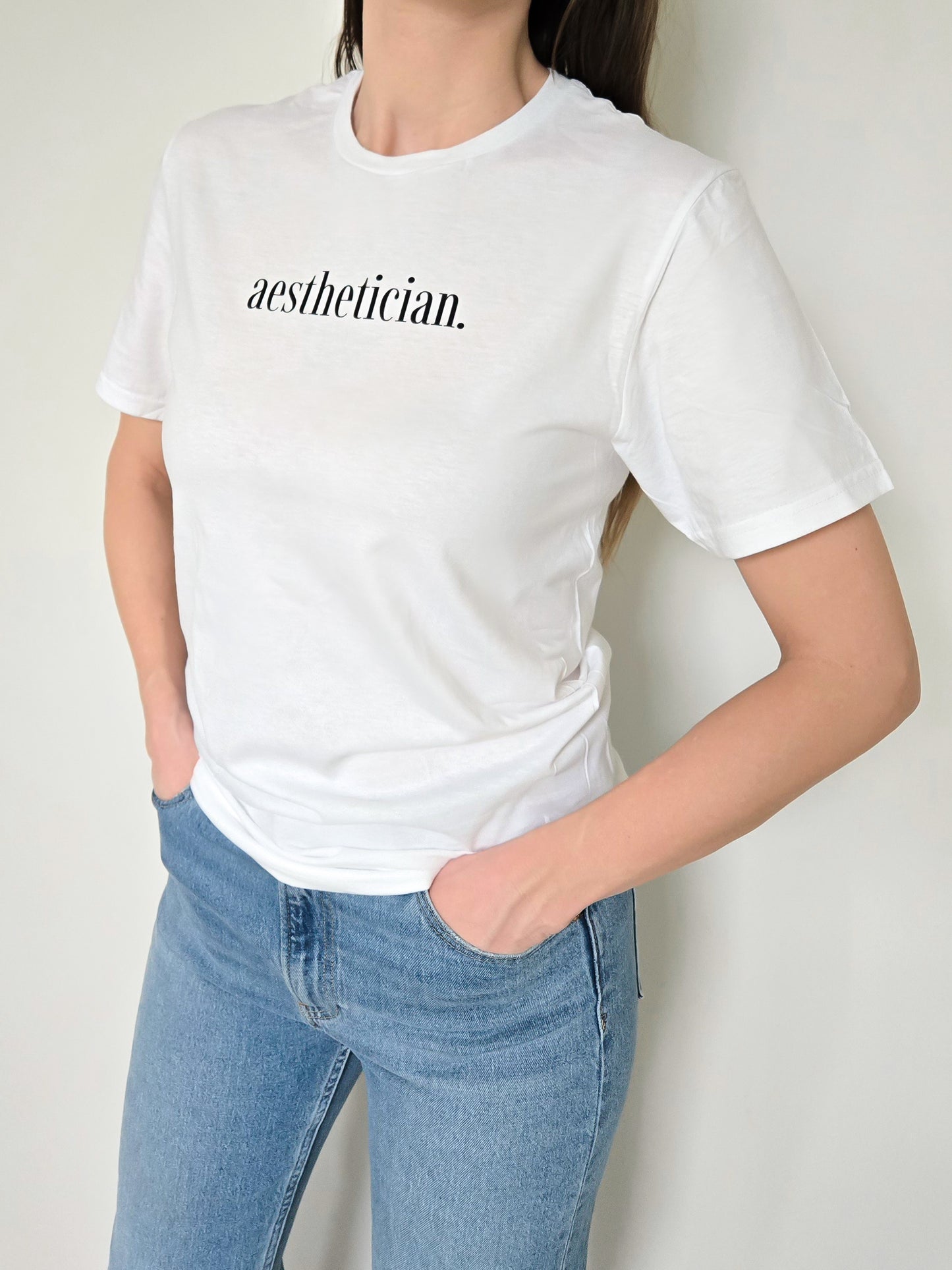 'aesthetician.' Tee- White