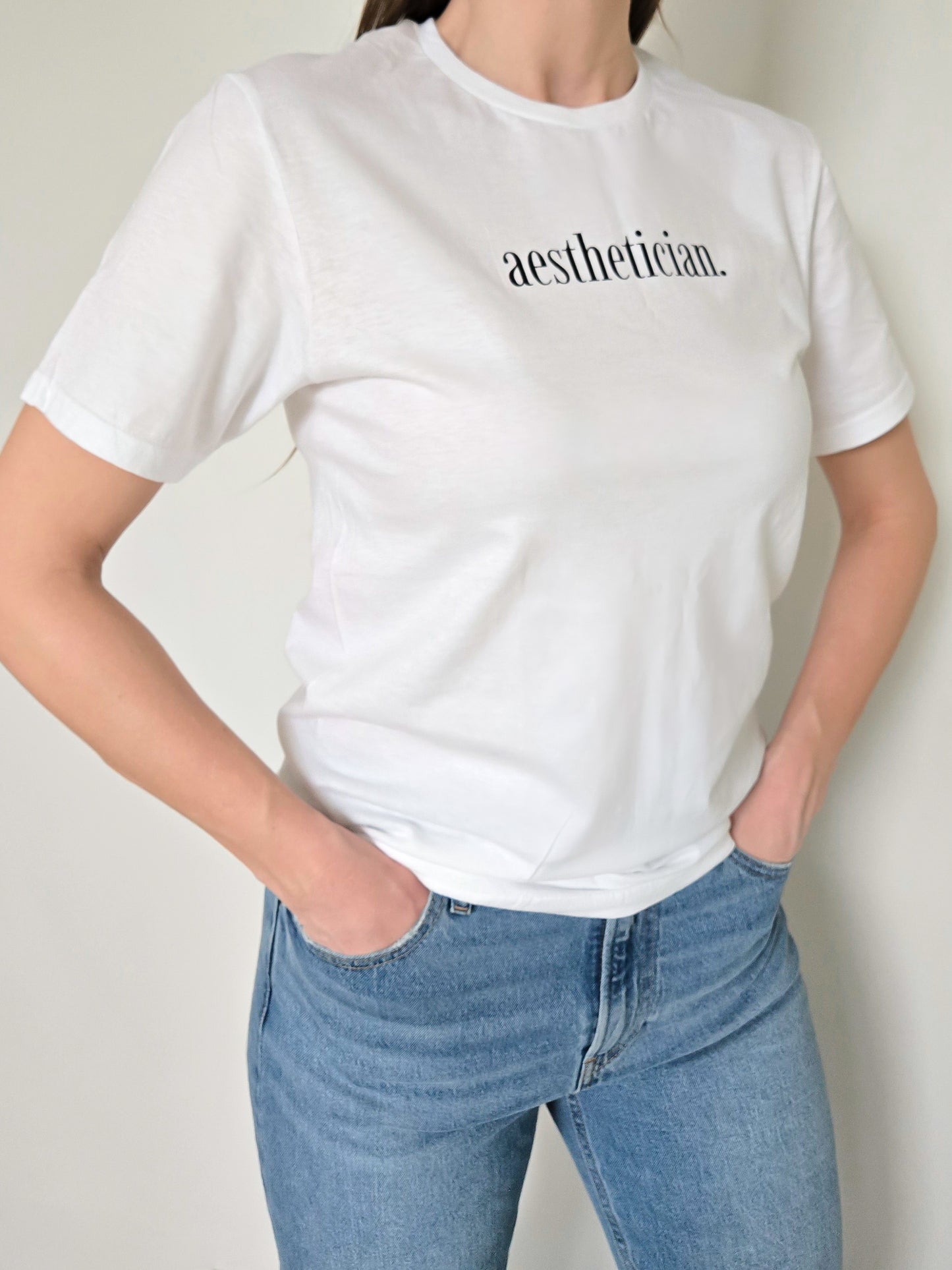 'aesthetician.' Tee- White